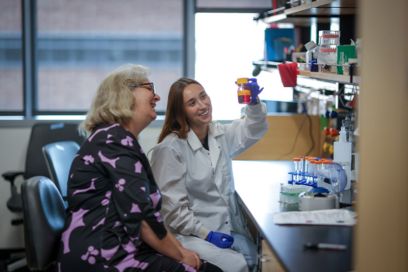 Scientist working with patient in the laboratory