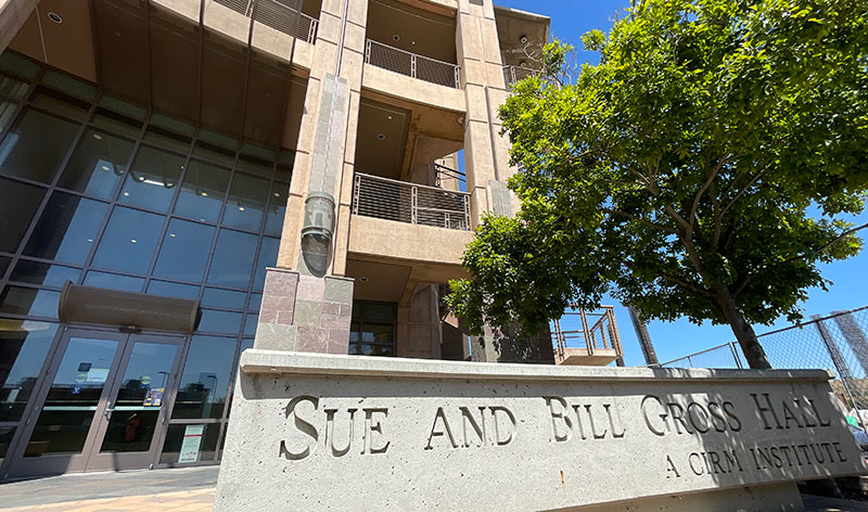 Sue and Bill Gross Hall, a CIRM Institute - a multistory building with large glass windows.